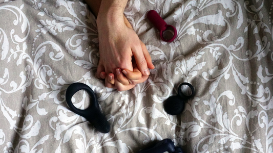 Beginners trying anal toys holding hands